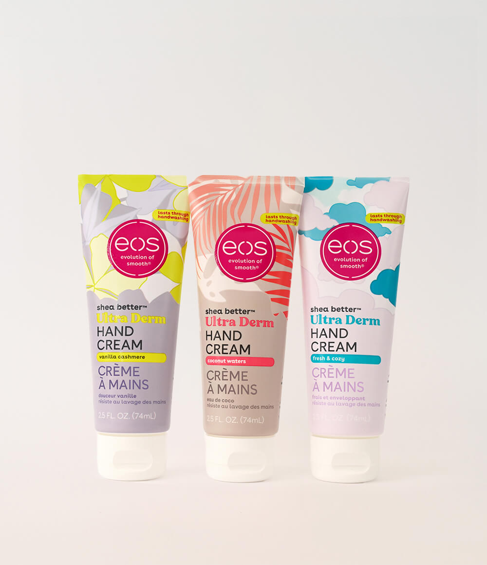 Three tubes of eos hand cream on a white background